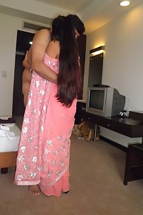 young indian couple getting naught in bedroom after party