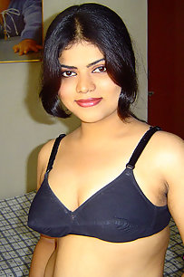 Sexy Indian Neha Nair in bedroom showing her assets off