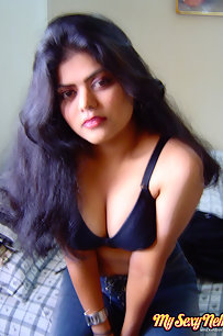 Sexy Indian Neha Nair in bedroom showing her assets off