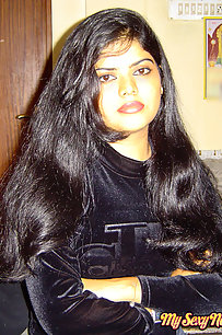 Sexy Indian Neha Nair in bedroom showing her assets off