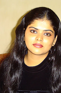 Sexy Indian Neha Nair in bedroom showing her assets off