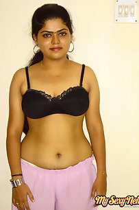 Indian Neha getting her clothes off in bedroom to get fucked