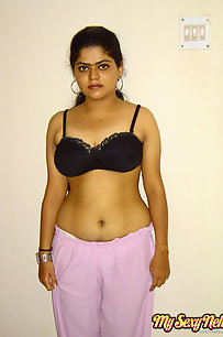 Indian Neha getting her clothes off in bedroom to get fucked