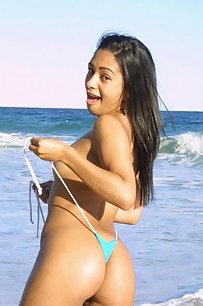 young indian gf on beach taking her bikini off