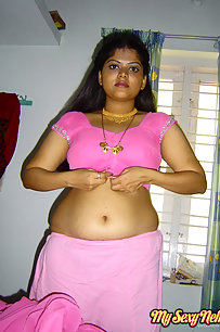 Delicious Indian Neha bhabhi stripping her pink saree off showing pussy
