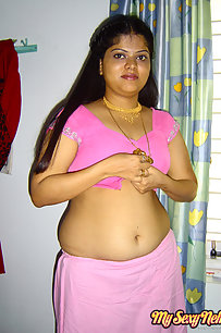 Delicious Indian Neha bhabhi stripping her pink saree off showing pussy