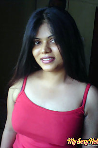 Hot Neha bhabhi in her bedroom showing her juicy boobs