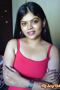 Hot Neha bhabhi in her bedroom showing her juicy boobs