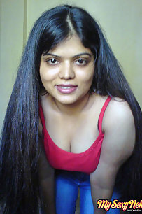 Hot Neha bhabhi in her bedroom showing her juicy boobs