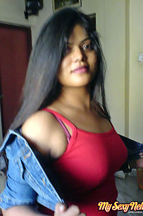 Hot Neha bhabhi in her bedroom showing her juicy boobs