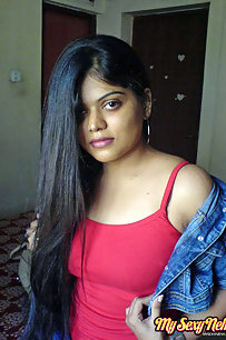 Hot Neha bhabhi in her bedroom showing her juicy boobs