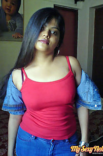 Hot Neha bhabhi in her bedroom showing her juicy boobs