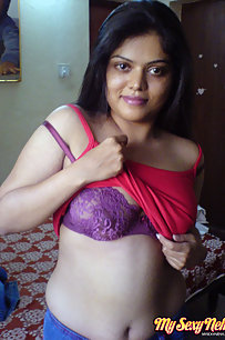 Hot Neha bhabhi in her bedroom showing her juicy boobs
