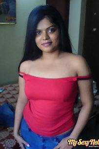Hot Neha bhabhi in her bedroom showing her juicy boobs