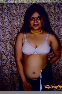 Gorgeous Neha Nair in white bra giving seductive poses and playing with bigtits