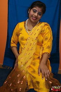 Horny looking Rupali bhabhi in yellow shalwar suit looking hot