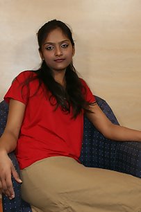 Divya in red top and brown skirt teasing her fan licking oranges