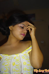 Neha Indian bhabhi showing off her big boobs in yellow camisole
