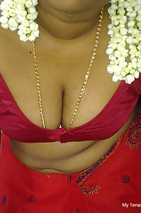 mature indian housewife taking her indian outfits off in bedroom