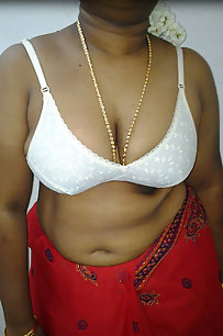 mature indian housewife taking her indian outfits off in bedroom